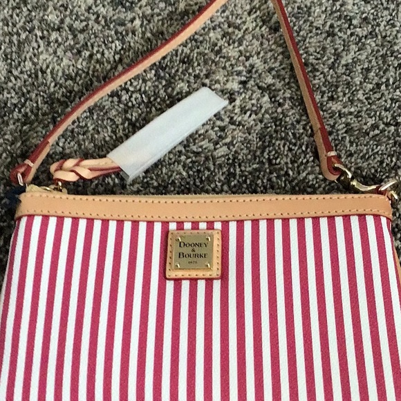 Dooney & Bourke Handbags - Dooney & Bourke pink & white striped bag/wristlet. New with tags.